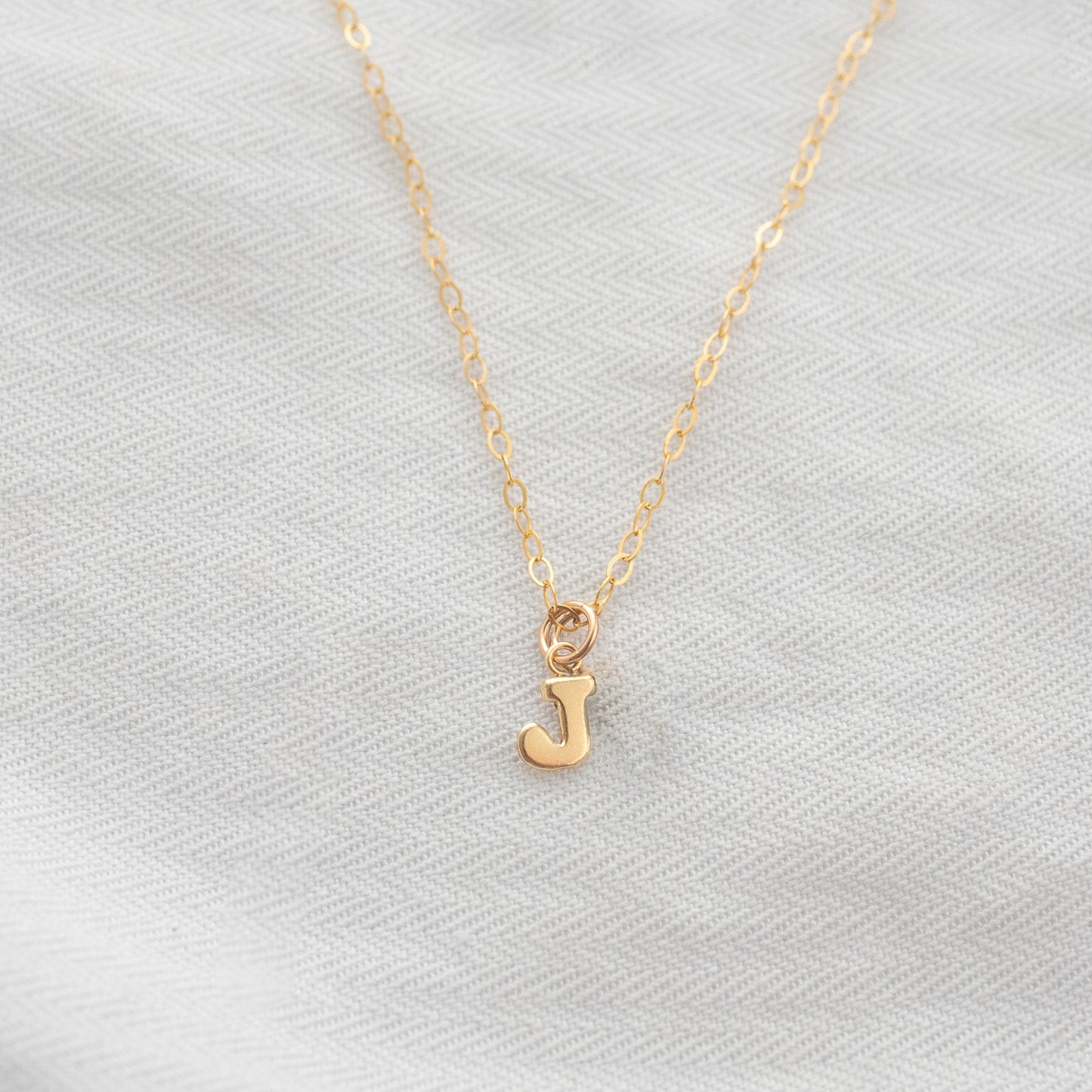 
                  
                    Dainty Initial Necklace
                  
                