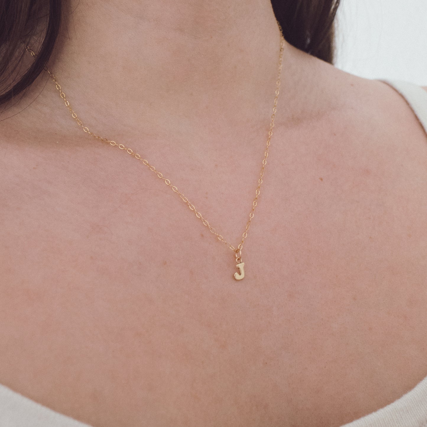 
                  
                    Dainty Initial Necklace
                  
                