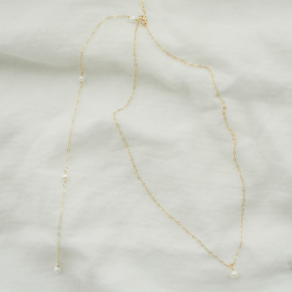 
                  
                    Petite Pearl Back Necklace
                  
                