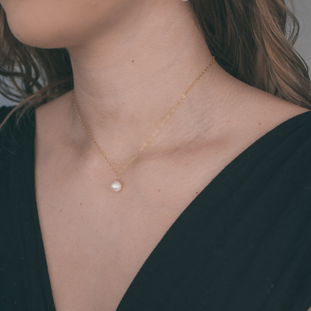 
                  
                    Pearl Trio Back Necklace
                  
                