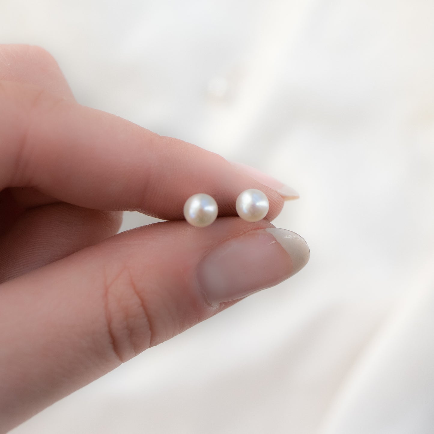 
                  
                    Pearl Studs
                  
                