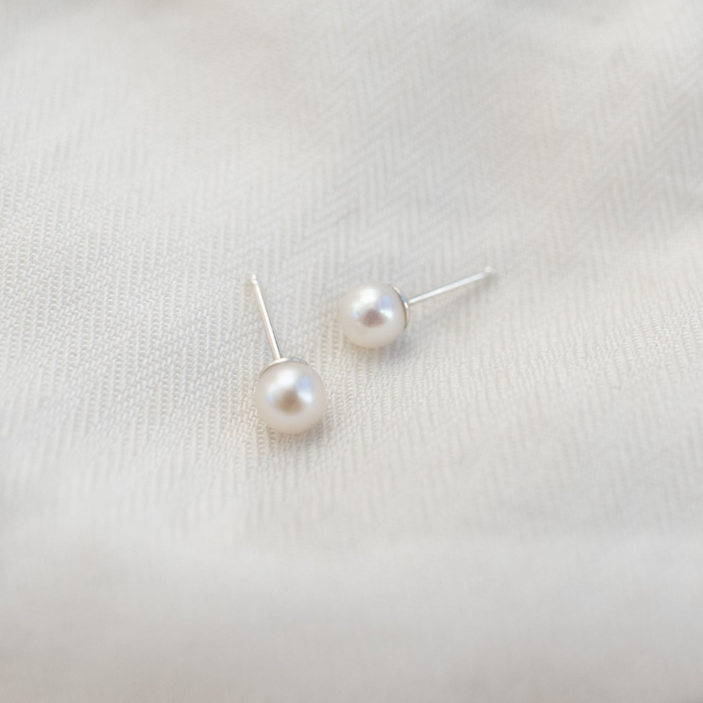 
                  
                    Pearl Studs
                  
                