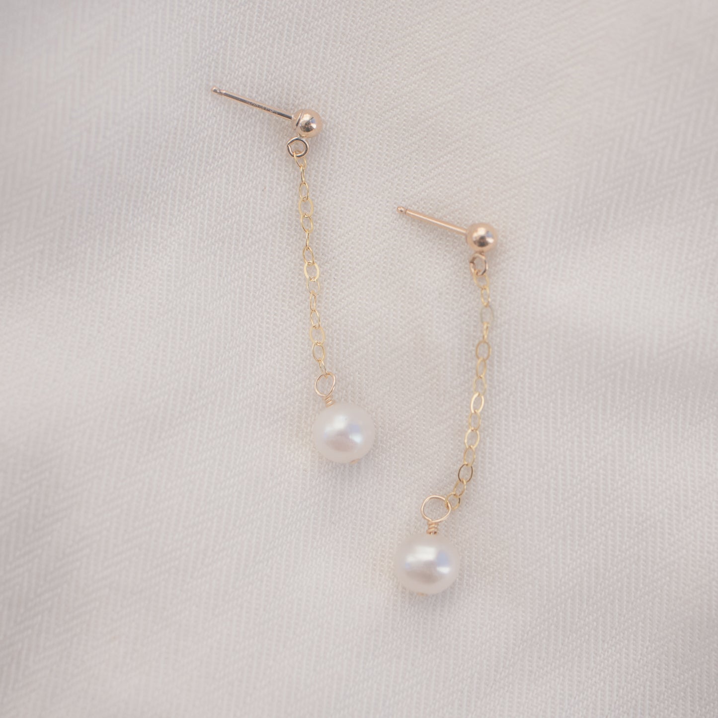 
                  
                    Pearl Drop Studs
                  
                