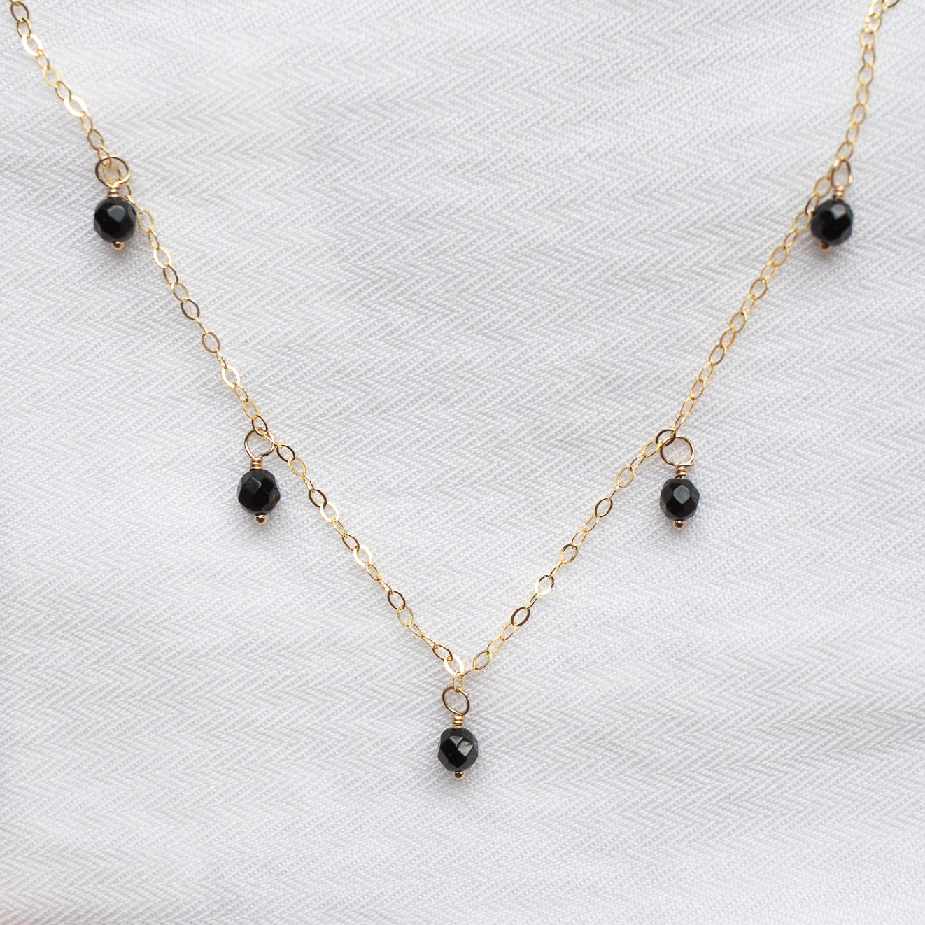 
                  
                    Onyx Droplet Necklace
                  
                