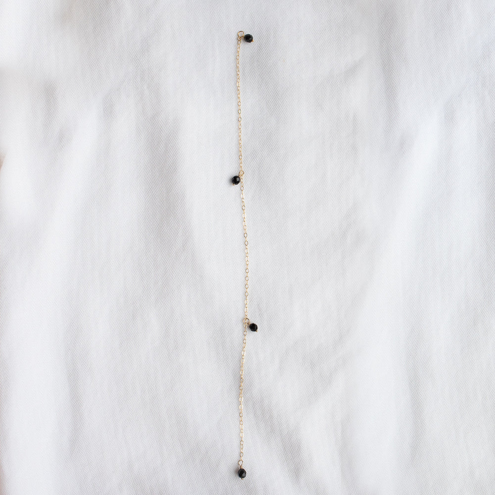 
                  
                    Onyx Droplet Back Necklace
                  
                