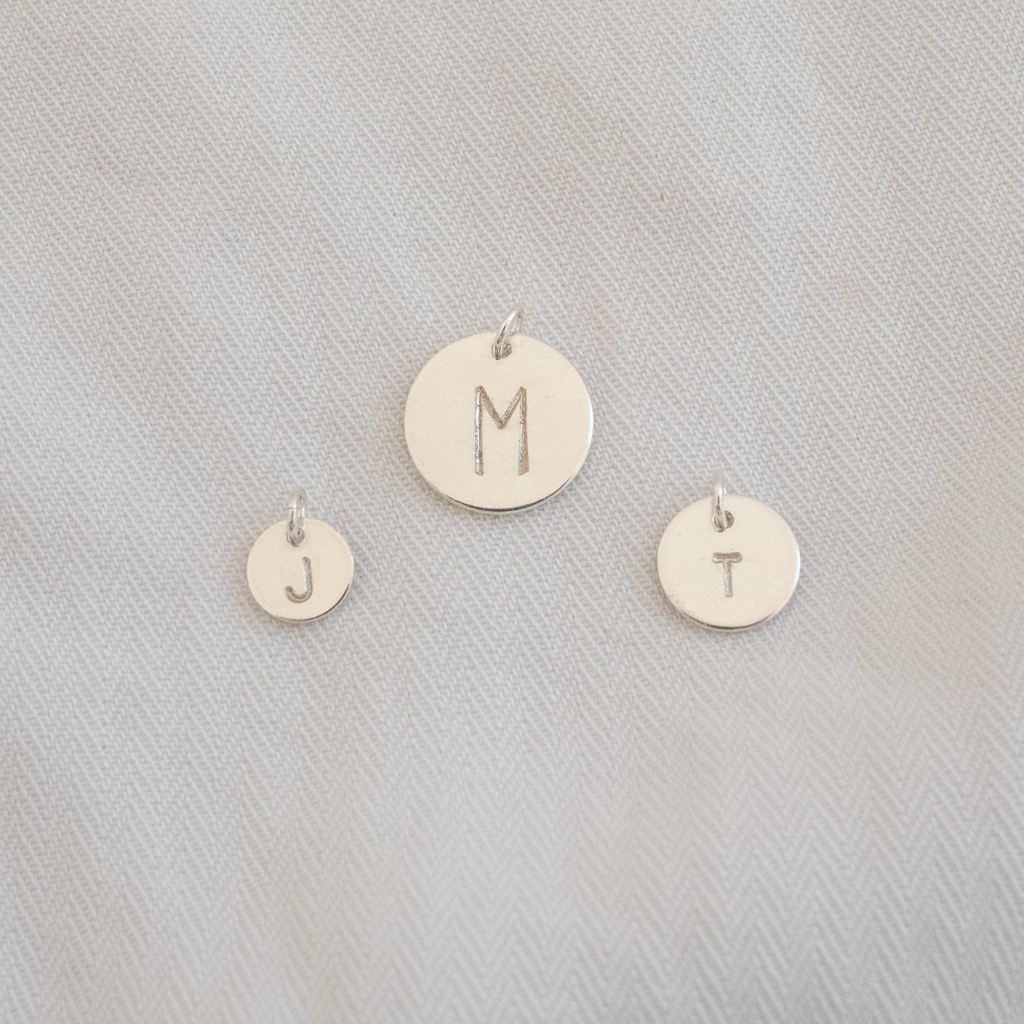 
                  
                    Initial Disc Charms
                  
                
