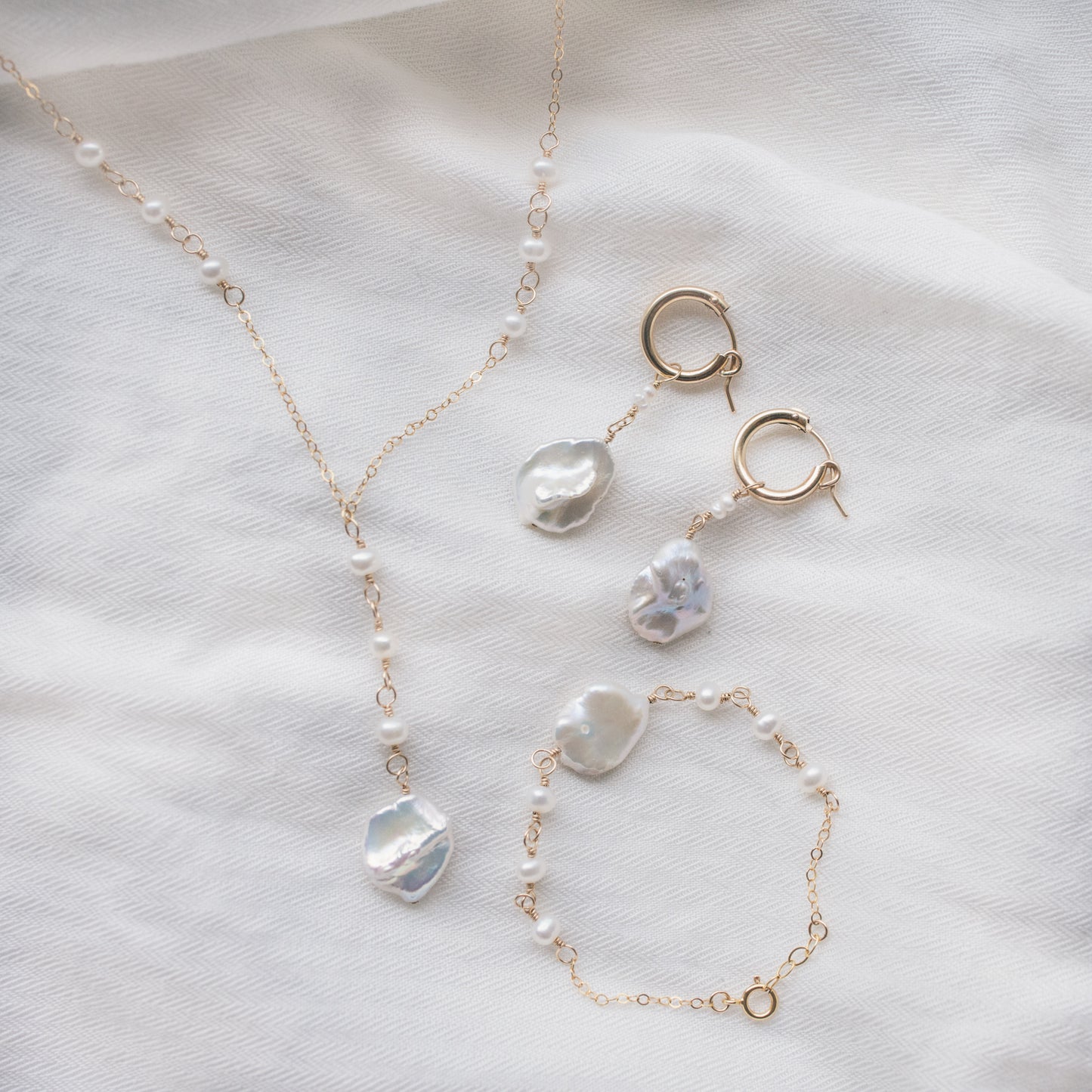 
                  
                    Poppy Lariat Necklace
                  
                