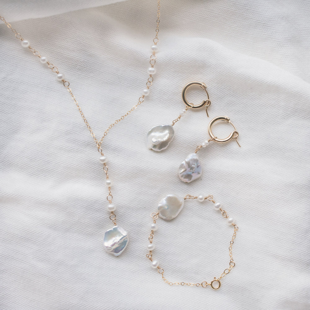 
                  
                    Poppy Huggie Hoops
                  
                