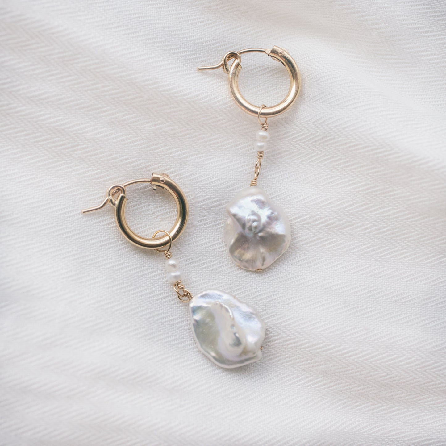 
                  
                    Poppy Huggie Hoops
                  
                