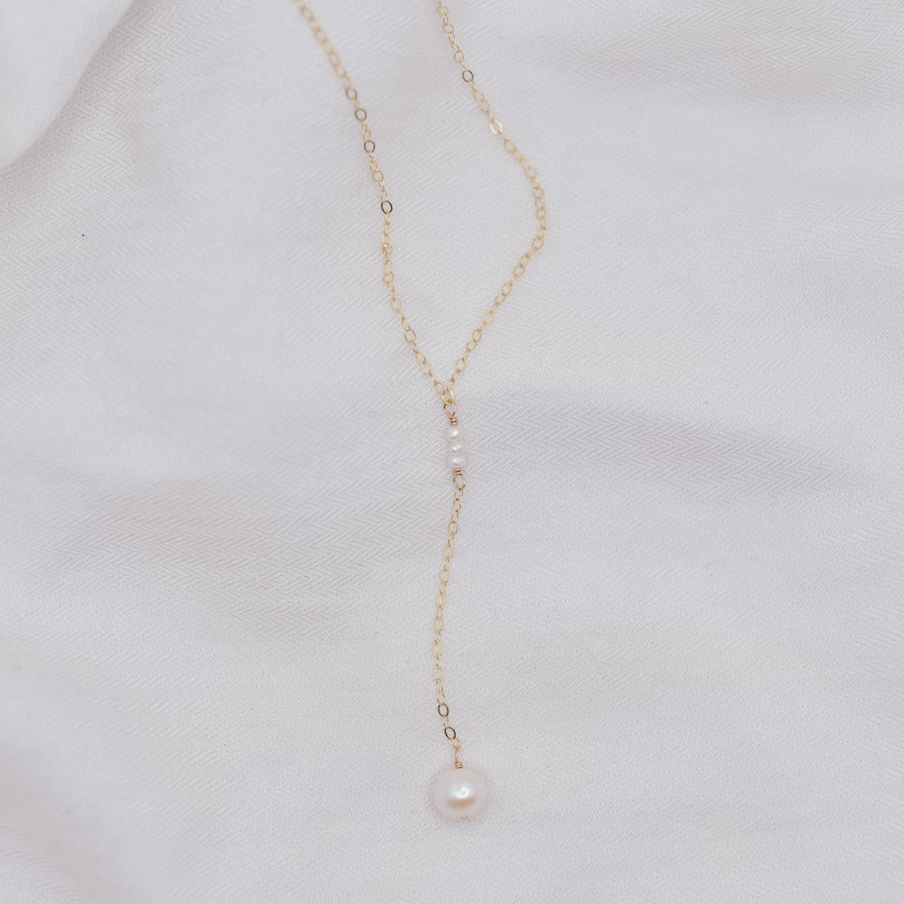 
                  
                    Classic Pearl Lariat Necklace
                  
                