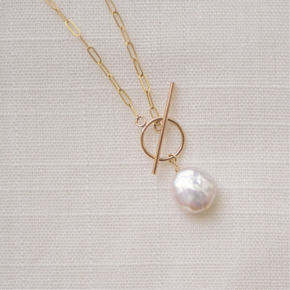 
                  
                    Pearl  Toggle Necklace with Gold drawn cable chain, toggle closure, and coin freshwater pearl
                  
                