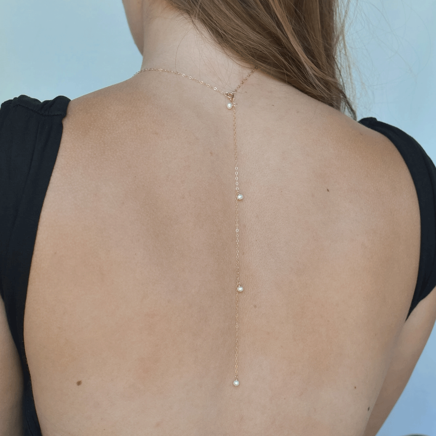 
                  
                    Pearl Droplet Back Necklace
                  
                