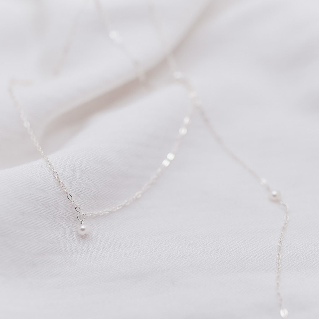 
                  
                    Petite Pearl Back Necklace
                  
                
