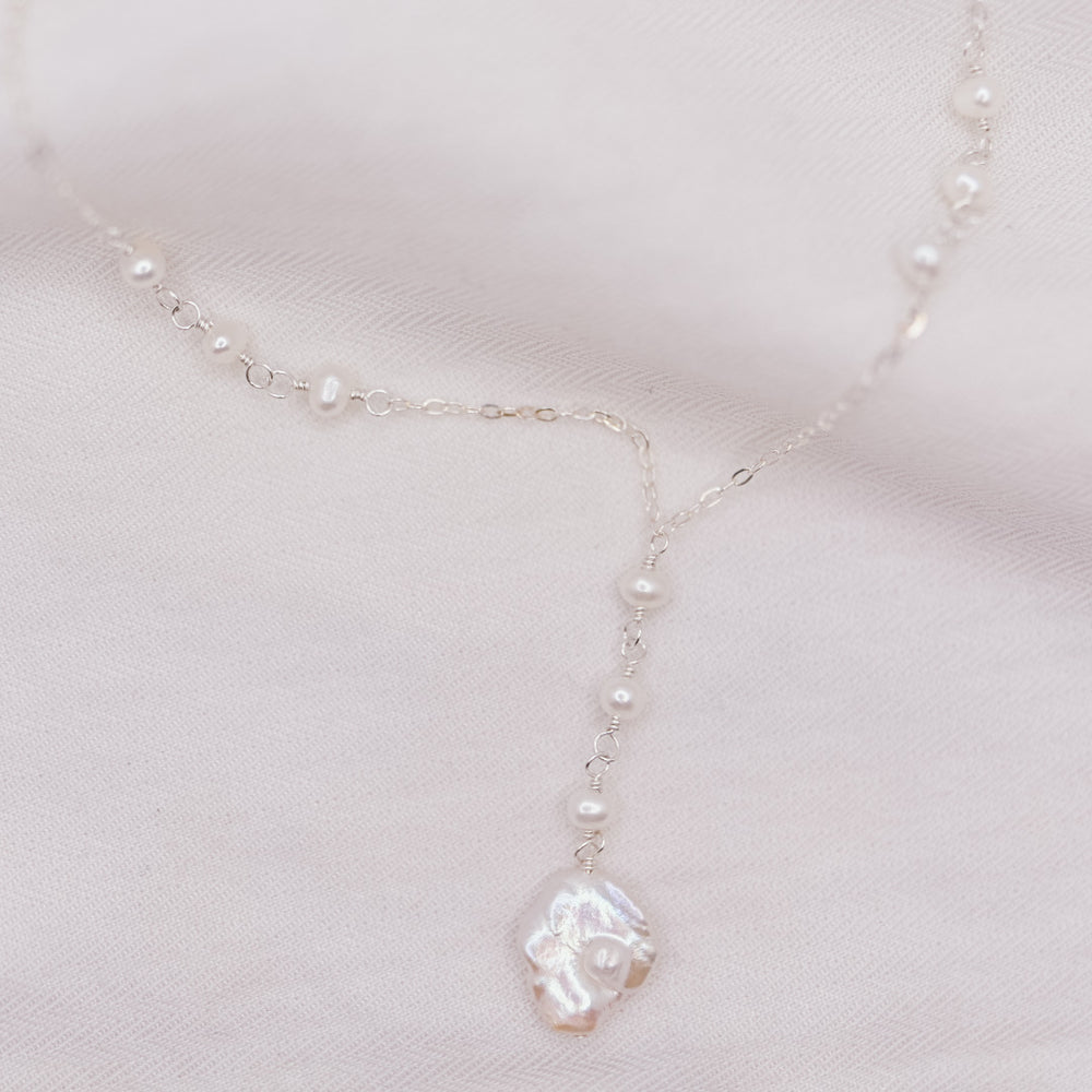 
                  
                    Poppy Lariat Necklace
                  
                