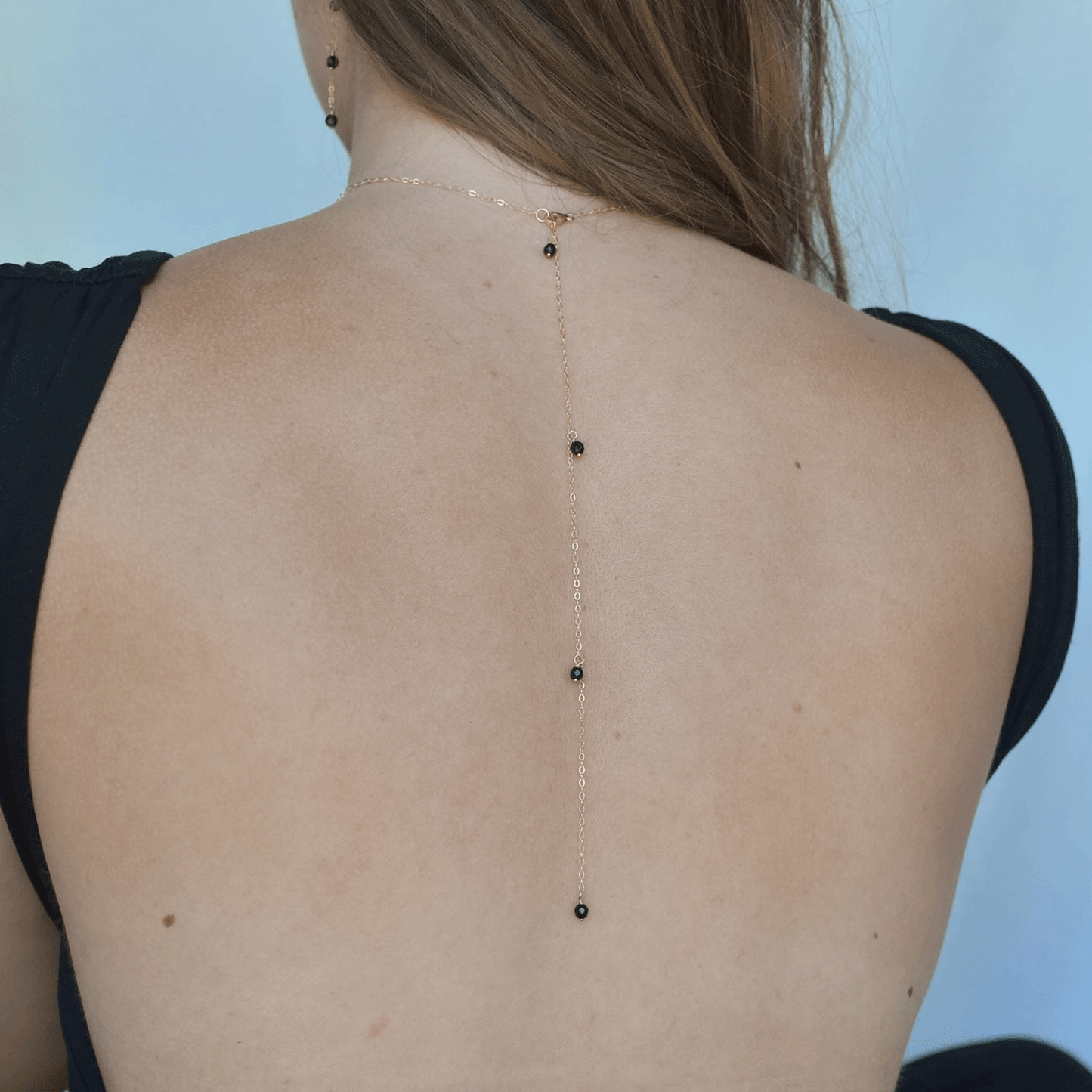 
                  
                    Onyx Droplet Back Necklace
                  
                